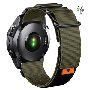 Olive green nylon Apple Watch band with black hardware and orange accent, shown on smartwatch back